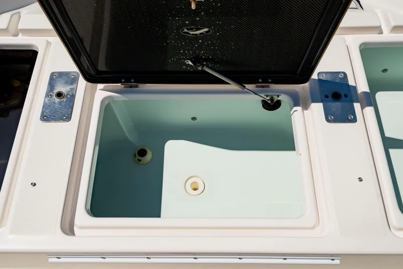 Slide: The Image of Open storage compartment on 2015 Edgewater 240 Inshore boat. - 11