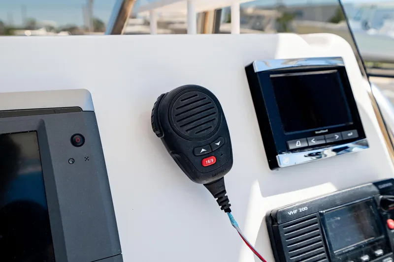 Slide: The Image of Control panel of 2015 Edgewater 240 Inshore boat with radio and navigation equipment. - 24