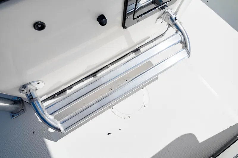 Slide: The Image of 2015 Edgewater 240 Inshore boat step detail with metal railing. - 29