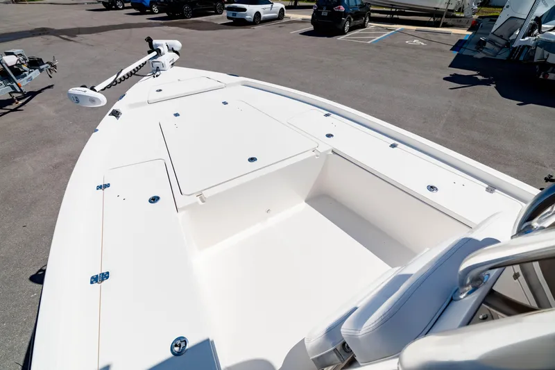 Slide: The Image of 2015 Edgewater 240 Inshore boat with spacious deck and seating area. - 3