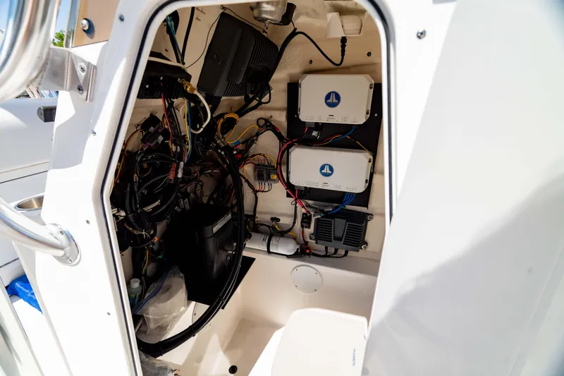 Slide: The Image of Interior view of 2015 Edgewater 240 Inshore boat's electrical wiring and components. - 6