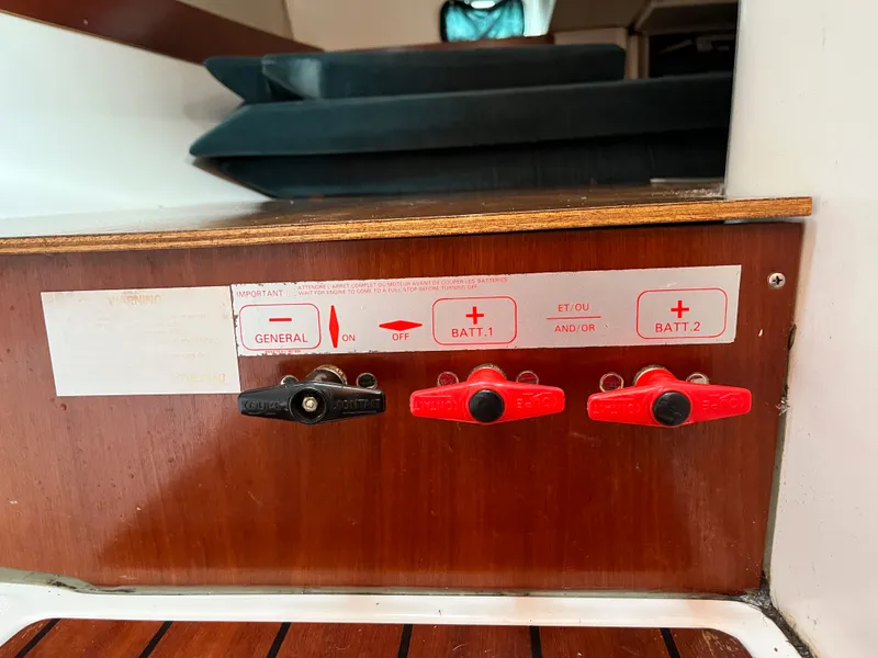 Slide: The Image of Control panel of a 1995 Beneteau Oceanis 321 sailboat with battery switches. - 70