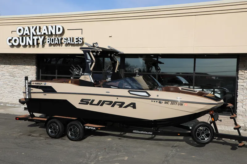 Slide: The Image of 2023 Supra SL boat at Oakland County Boat Sales dealership. - 10