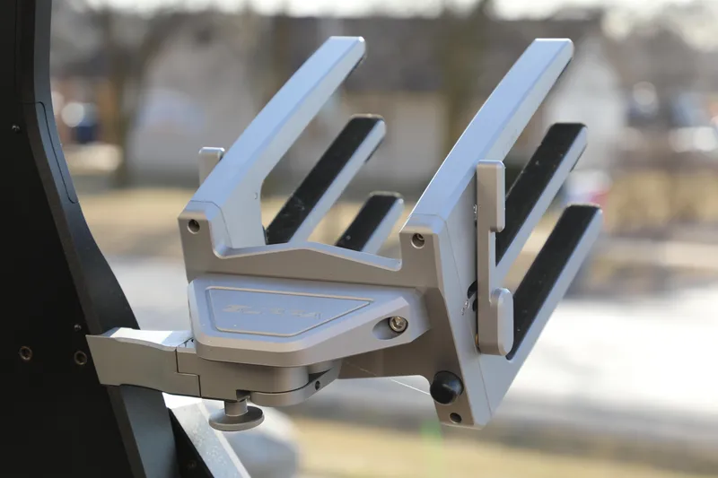 Slide: The Image of 2023 Supra SL wakeboard tower rack, silver, mounted on a boat, outdoors. - 15