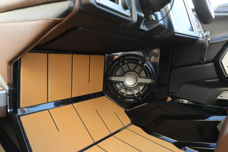 Slide: The Image of 2023 Supra SL interior with premium sound system and sleek design elements. - 18