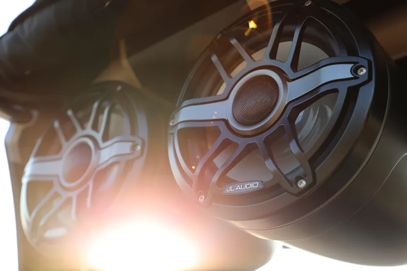 Slide: The Image of 2023 Supra SL speakers with sunlight glare, featuring JL Audio branding. - 2