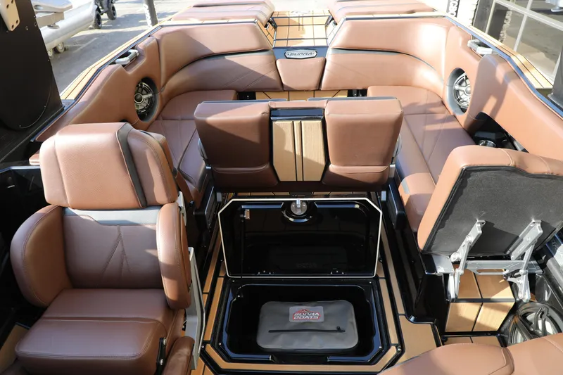 Slide: The Image of 2023 Supra SL boat interior with luxurious brown seating and modern design features. - 21