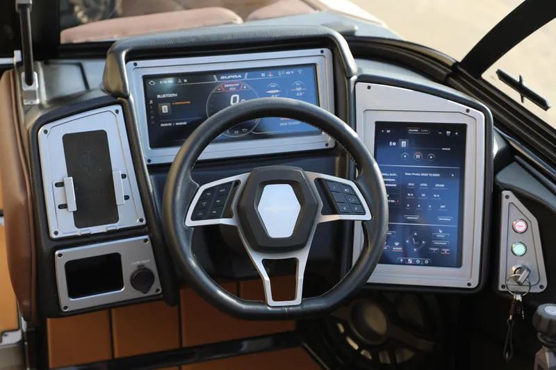 Slide: The Image of 2023 Supra SL dashboard with modern steering wheel and dual digital displays. - 24