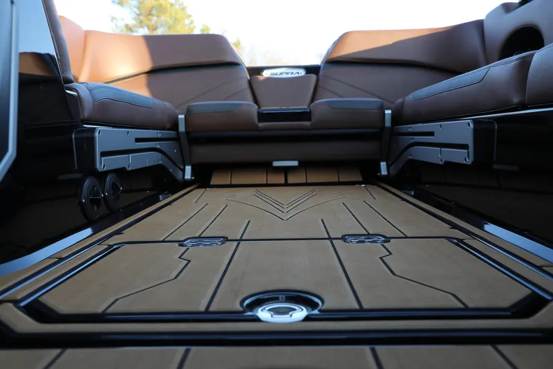 Slide: The Image of 2023 Supra SL interior with sleek brown seating and modern design elements. - 4