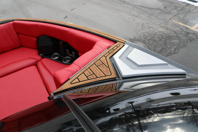 Slide: The Image of 2023 Malibu Wakesetter 22 LSV with red interior and sleek design details. - 14