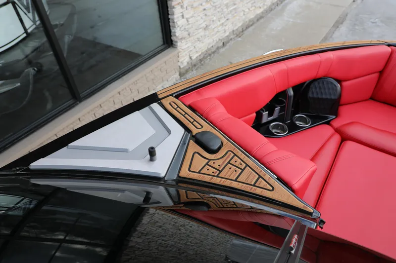 Slide: The Image of 2023 Malibu Wakesetter 22 LSV with red interior and sleek design details. - 15