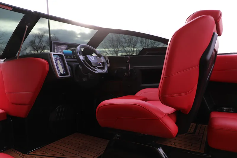 Slide: The Image of 2023 Malibu Wakesetter 22 LSV interior with red seats and modern dashboard. - 16