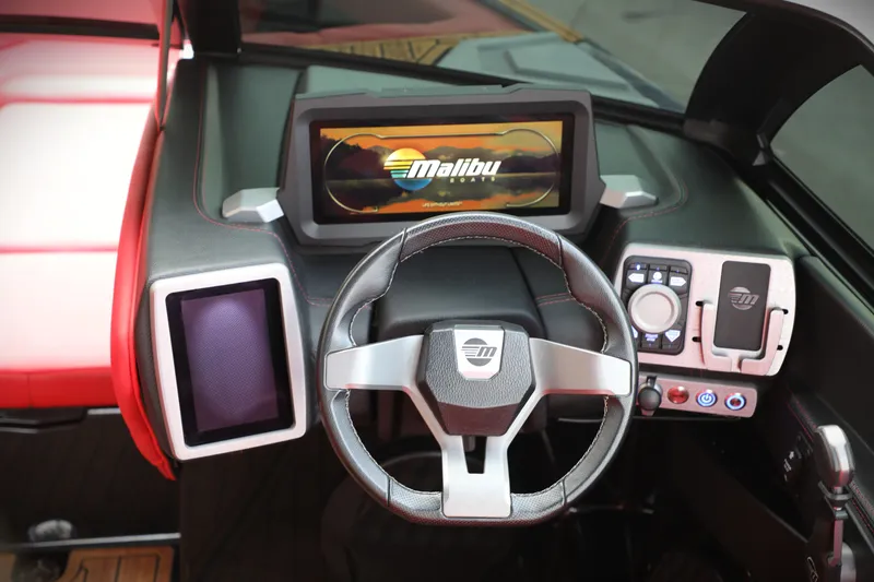 Slide: The Image of 2023 Malibu Wakesetter 22 LSV dashboard with modern steering and digital display. - 2