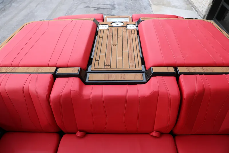 Slide: The Image of 2023 Malibu Wakesetter 22 LSV interior with red seating and wood accents. - 20
