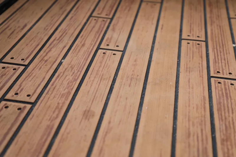 Slide: The Image of Teak-style flooring on 2023 Malibu Wakesetter 22 LSV boat deck. - 21