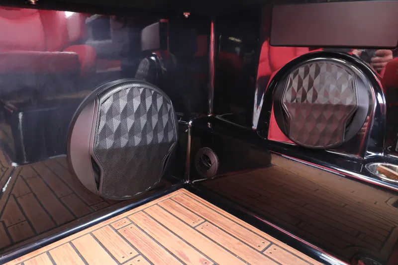 Slide: The Image of 2023 Malibu Wakesetter 22 LSV interior speakers and wood-style flooring detail. - 22
