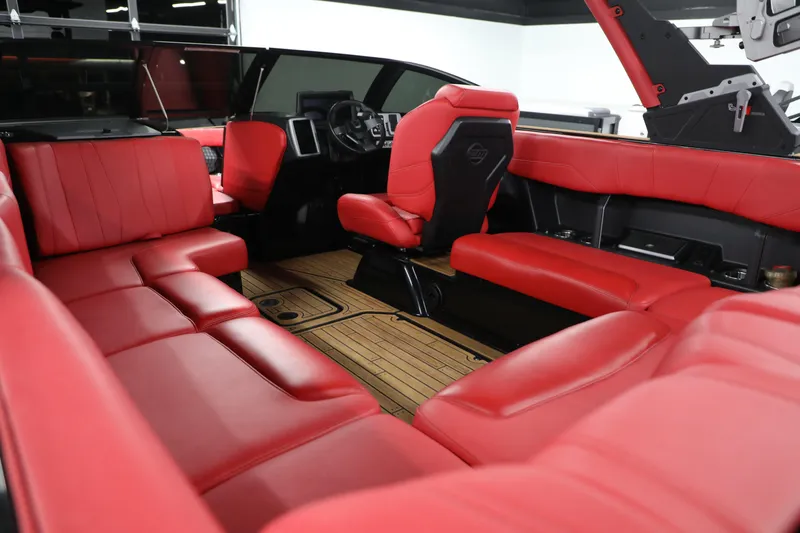 Slide: The Image of 2023 Malibu Wakesetter 22 LSV interior with luxurious red leather seating and sleek design. - 6