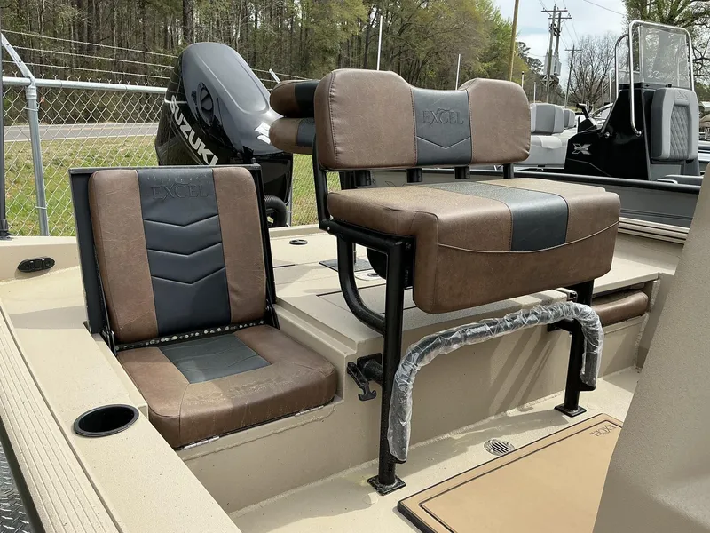 Slide: The Image of 2025 Excel Bay Pro 203 Elite boat seats with Suzuki engine in background. - 9