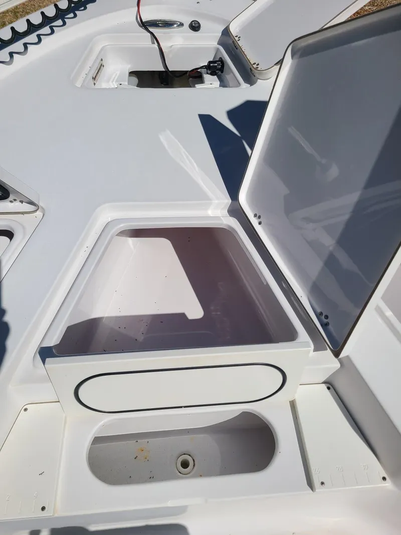 Slide: The Image of Open storage compartments on a 2018 Sportsman TOURNAMENT 214 boat deck. - 10
