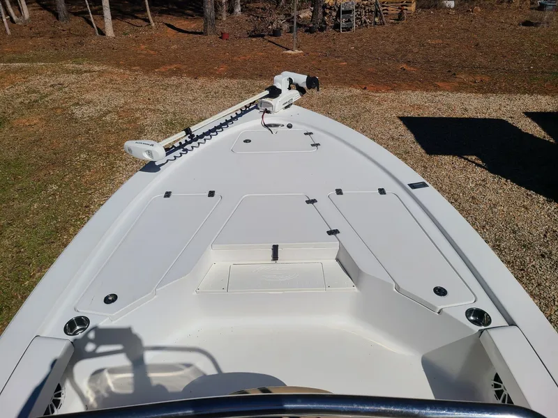 Slide: The Image of 2018 Sportsman TOURNAMENT 214 boat deck with storage compartments and trolling motor. - 11