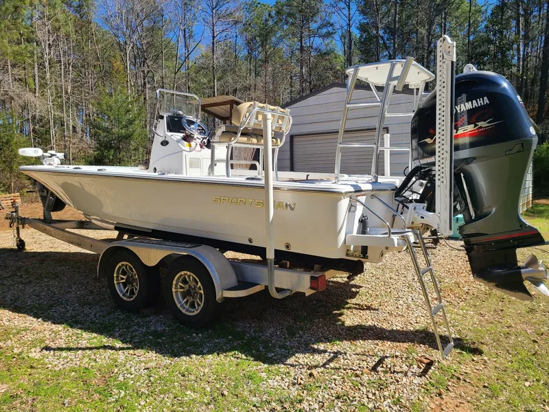 Slide: The Image of 2018 Sportsman TOURNAMENT 214 boat on trailer with Yamaha engine, parked outdoors. - 13