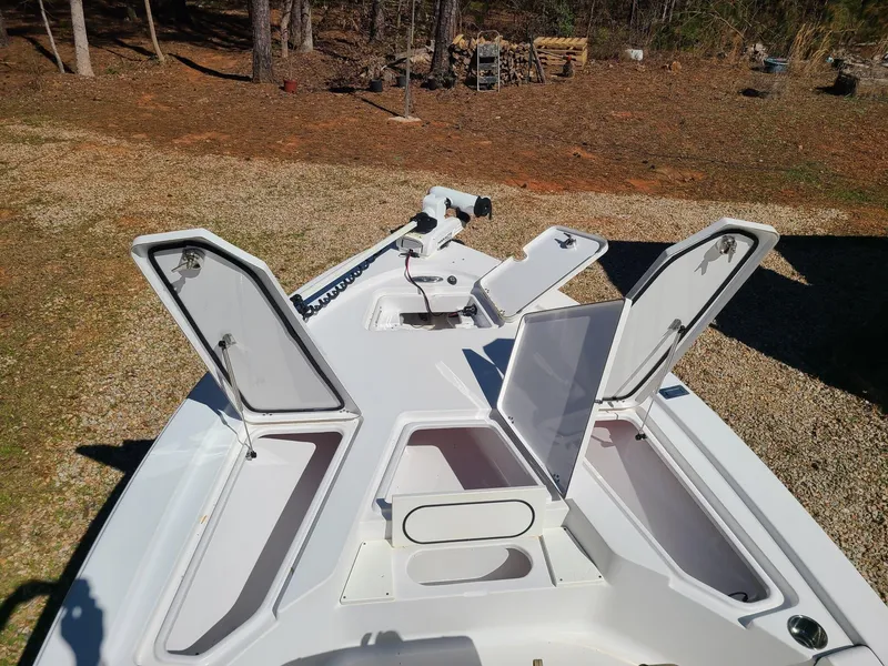 Slide: The Image of 2018 Sportsman TOURNAMENT 214 boat with open storage compartments on deck. - 14