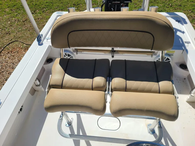 Slide: The Image of 2018 Sportsman TOURNAMENT 214 boat seating with tan cushions and stainless steel frame. - 16