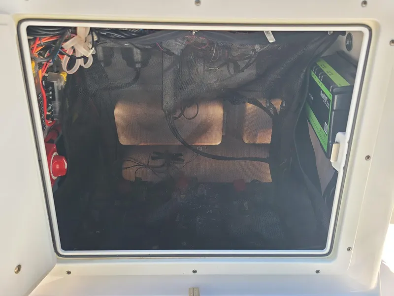 Slide: The Image of 2018 Sportsman TOURNAMENT 214 boat compartment with wiring and electronic components. - 4