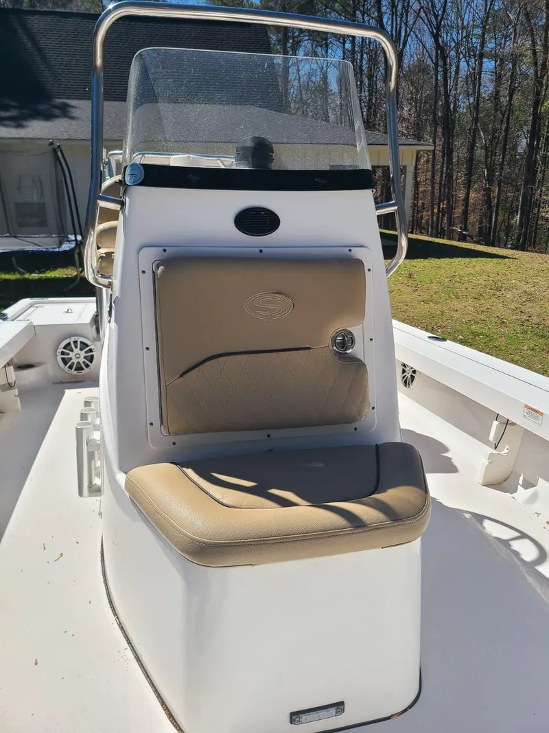 Slide: The Image of 2018 Sportsman TOURNAMENT 214 boat console with tan seating and windshield. - 5