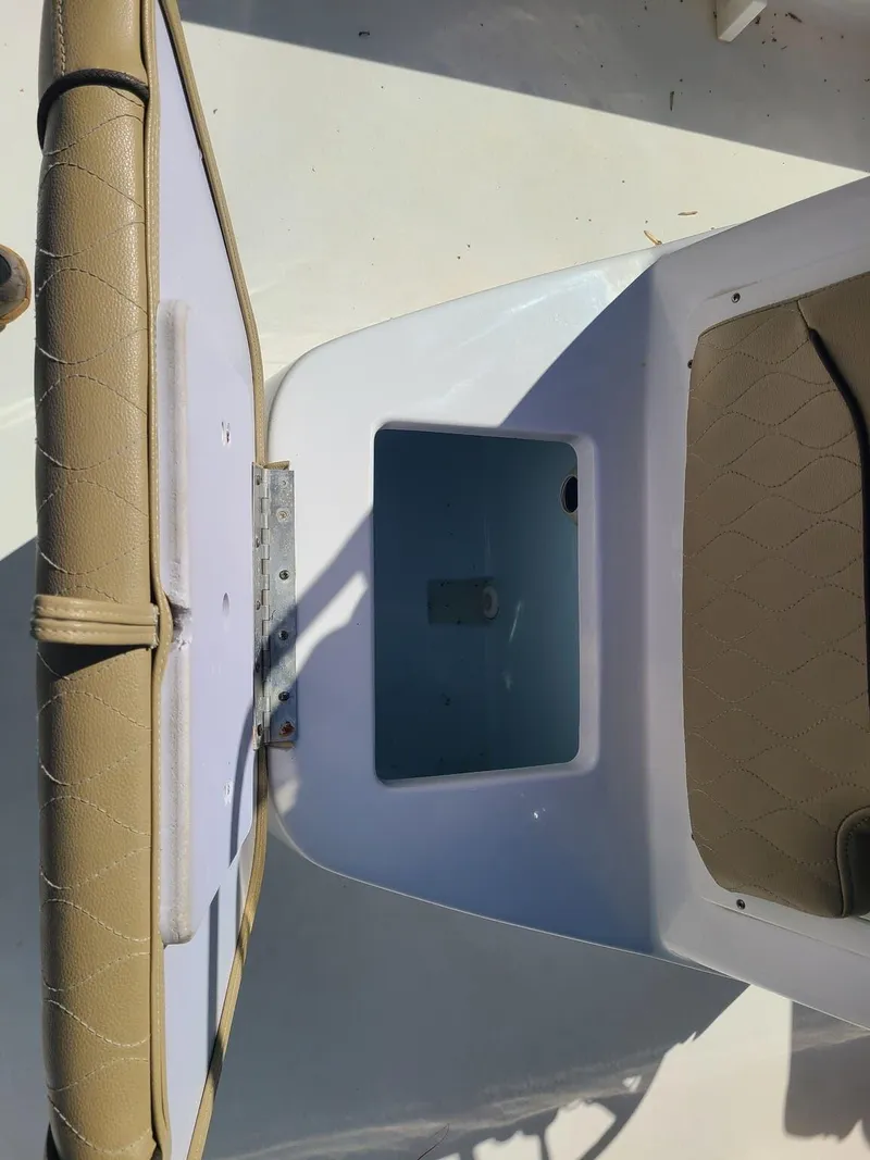 Slide: The Image of Open storage compartment on 2018 Sportsman TOURNAMENT 214 boat with beige seating. - 7