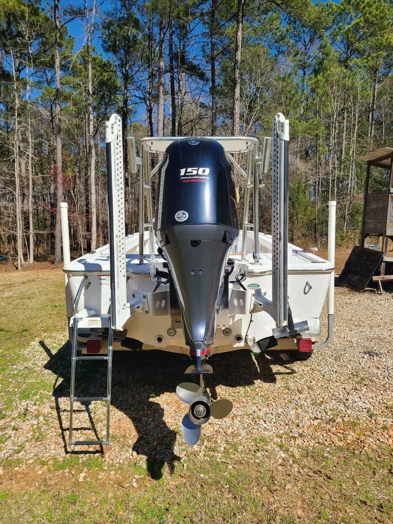 Slide: The Image of 2018 Sportsman TOURNAMENT 214 boat with 150 horsepower engine, parked outdoors. - 8