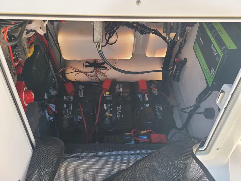 Slide: The Image of Battery compartment of a 2018 Sportsman TOURNAMENT 214 boat, showing wiring and connections. - 9