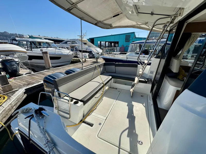 Slide: The Image of 2023 Jeanneau NC 1095 Fly yacht with spacious deck and seating at marina. - 4