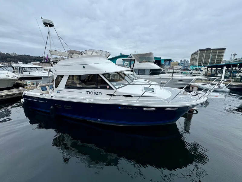 The Image of 2018 Cutwater C-30 CB boat docked in marina, overcast sky. - 1