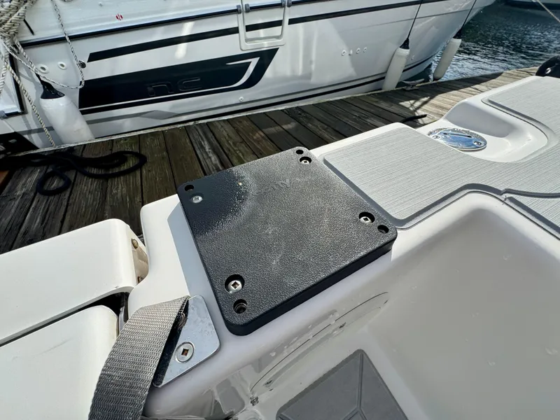 Slide: The Image of 2018 Cutwater C-30 CB boat deck detail with mounting plate, docked beside another vessel. - 11