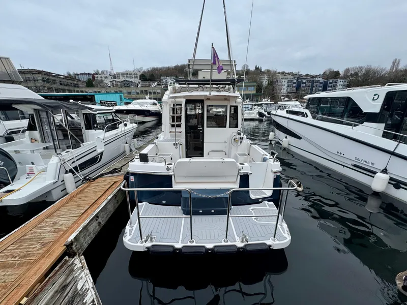 Slide: The Image of 2018 Cutwater C-30 CB boat docked at marina, rear view. - 4