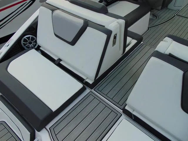Slide: The Image of 2023 Yamaha Boats 252SD interior seating with sleek, modern design and comfortable upholstery. - 10