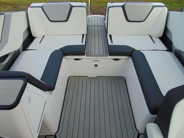 Slide: The Image of 2023 Yamaha Boats 252SD interior seating with sleek, modern design and comfortable upholstery. - 12