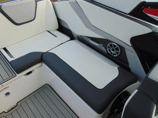 Slide: The Image of 2023 Yamaha Boats 252SD interior seating with sleek design and integrated speaker system. - 13
