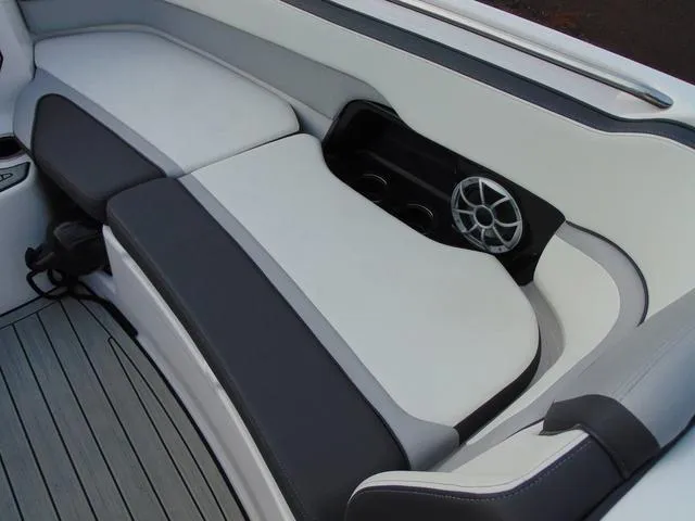Slide: The Image of 2023 Yamaha Boats 252SD interior seating with speaker and cup holders. - 20