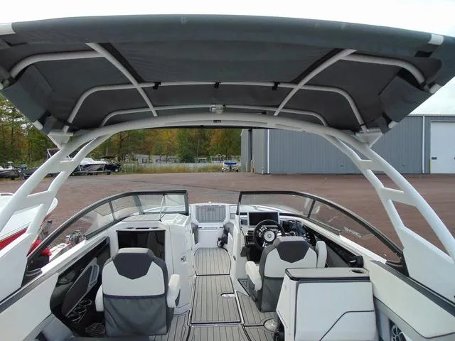 Slide: The Image of 2023 Yamaha Boats 252SD interior with sleek seating and modern dashboard design. - 8
