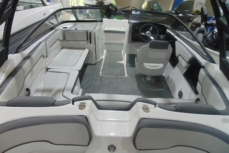 Slide: The Image of 2025 Yamaha Boats AR190 interior with sleek seating and modern dashboard design. - 15