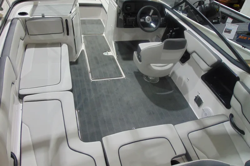 Slide: The Image of 2025 Yamaha Boats AR190 interior with spacious seating and modern helm design. - 16