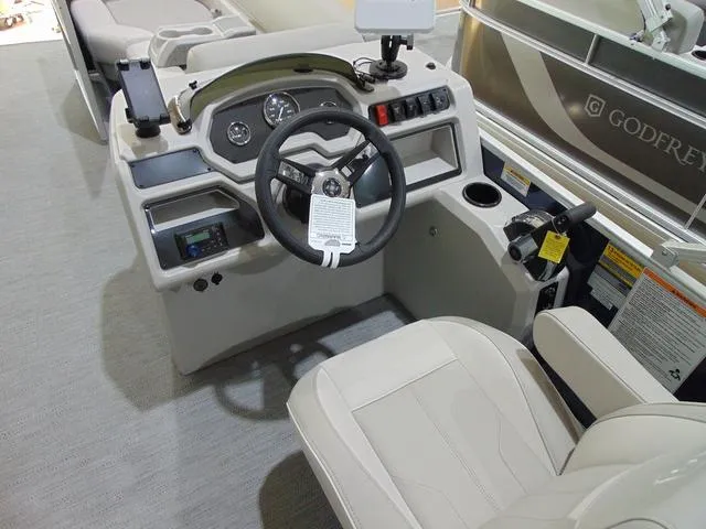 Slide: The Image of 2025 Godfrey Pontoons Sweetwater 2286 SFL Sport Tube helm with steering wheel and controls. - 11