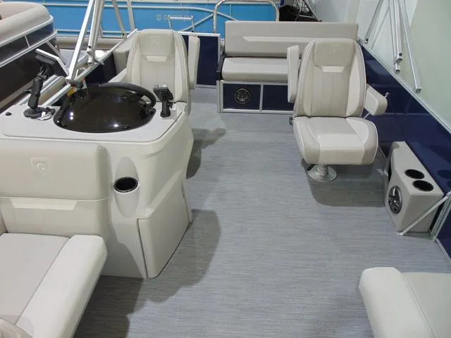 Slide: The Image of 2025 Godfrey Sweetwater 2286 SFL Sport Tube interior with plush seating and modern helm. - 9