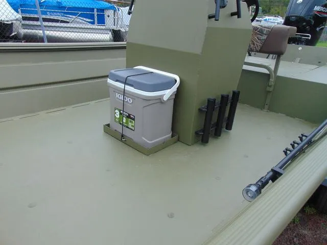 Slide: The Image of 2024 Crestliner 2070 Retriever CC boat interior with Igloo cooler and fishing rod holders. - 10