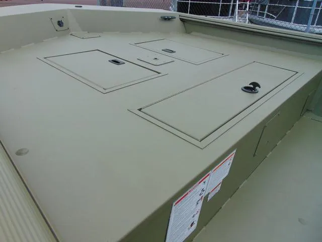 Slide: The Image of 2024 Crestliner 2070 Retriever CC boat deck with storage compartments. - 9