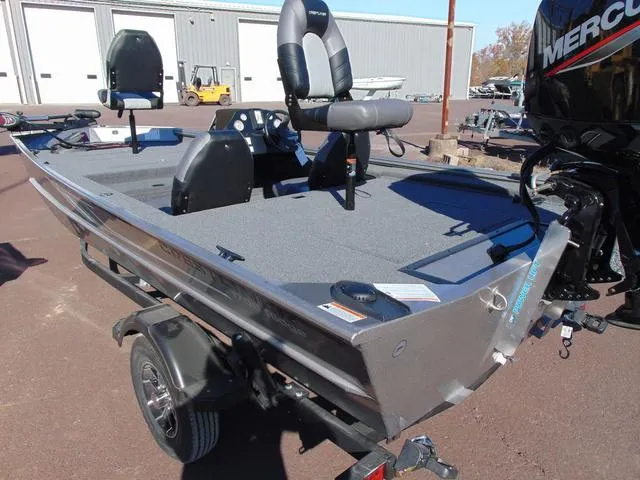 Slide: The Image of 2025 Crestliner 1700 Ridge boat on trailer, featuring dual seats and Mercury outboard motor. - 3