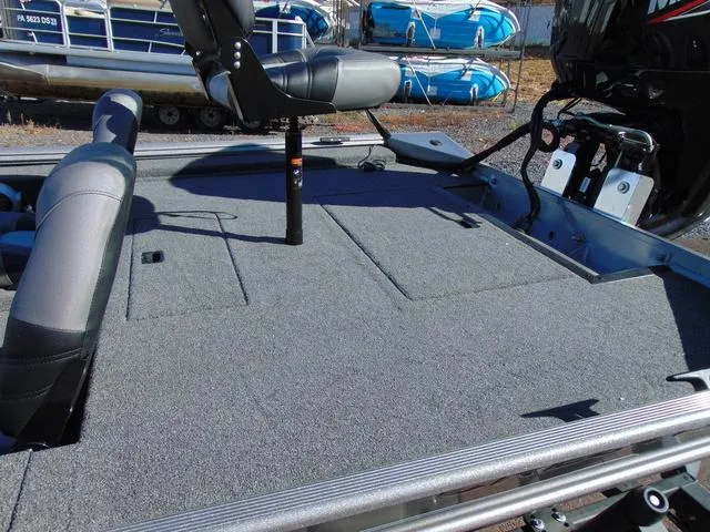 Slide: The Image of 2025 Crestliner 1700 Ridge boat interior with seating and storage compartments. - 4