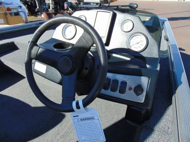 Slide: The Image of Steering console of 2025 Crestliner 1700 Ridge boat with gauges and controls. - 7